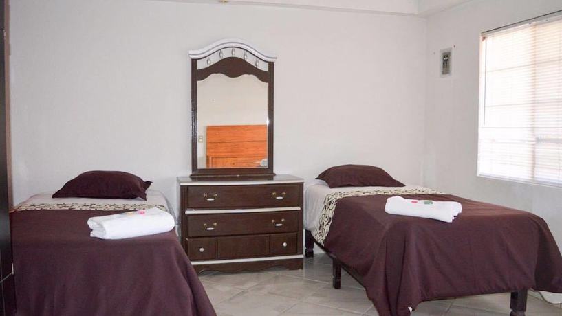 Imagen de la habitación del Hotel and Suites Cerro Rojo. Foto 14