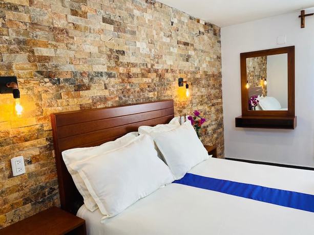 Imagen de la habitación del Hotel and Suites Cerro Rojo. Foto 16