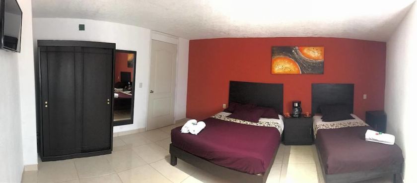 Imagen de la habitación del Hotel and Suites Cerro Rojo. Foto 17