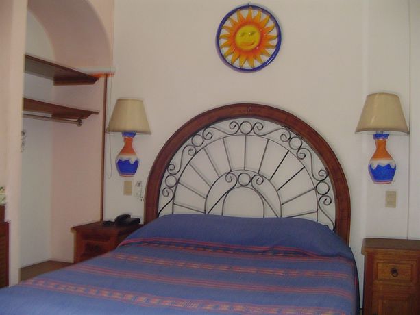 Imagen de la habitación del Hotel and Suites Coral. Foto 4