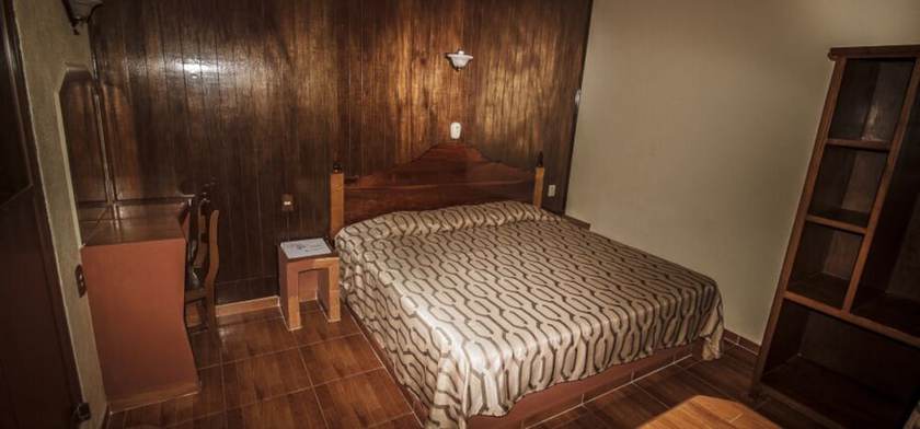 Imagen de la habitación del Hotel and Suites Posada Molina. Foto 18