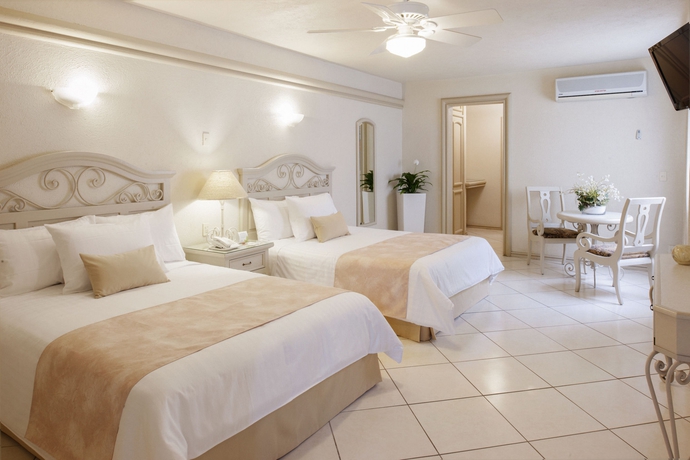 Imagen de la habitación del Hotel and Suites Quinta Magna. Foto 9