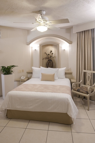 Imagen de la habitación del Hotel and Suites Quinta Magna. Foto 12