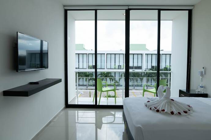Imagen de la habitación del Hotel and Suites Yuca Ville. Foto 14