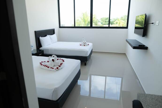 Imagen de la habitación del Hotel and Suites Yuca Ville. Foto 17