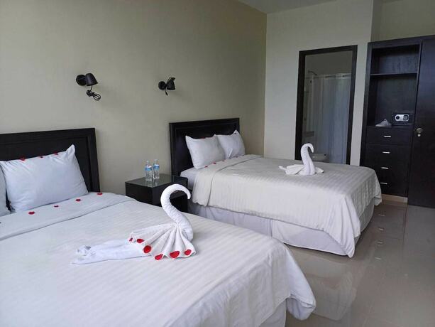 Imagen de la habitación del Hotel and Suites Yuca Ville. Foto 18
