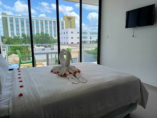 Imagen de la habitación del Hotel and Suites Yuca Ville. Foto 19
