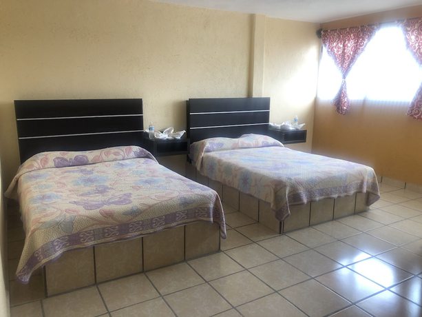 Imagen de la habitación del Hotel and Villas Monarca Circuito. Foto 8