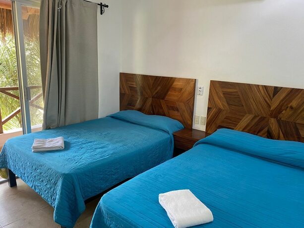 Imagen de la habitación del Hotel and Villas Palma Real. Foto 15