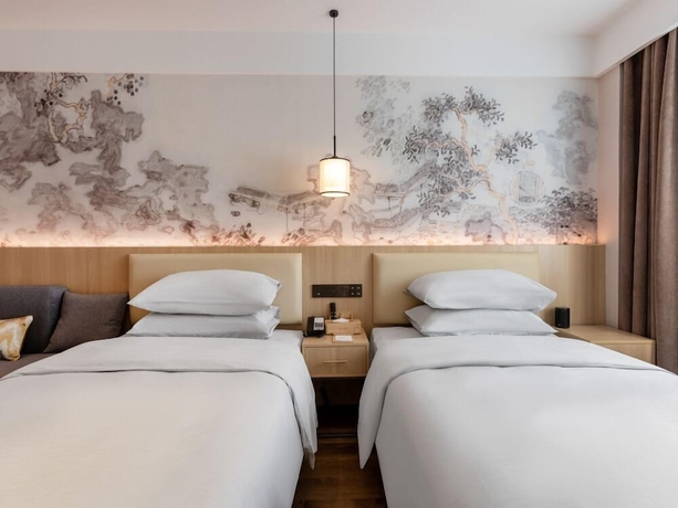 Imagen de la habitación del Hotel beijingyonghegongsiheyuanyunjujiudian. Foto 3