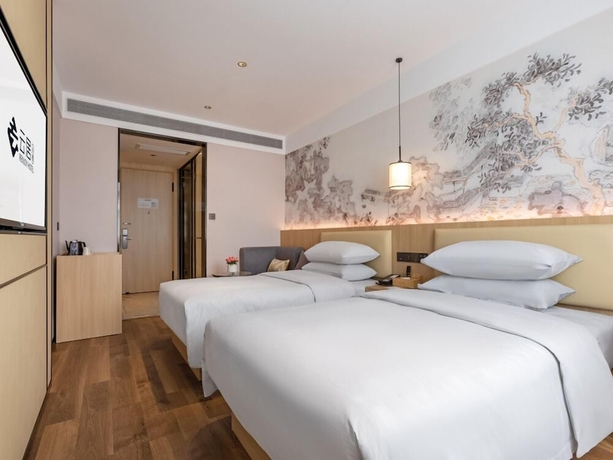 Imagen de la habitación del Hotel beijingyonghegongsiheyuanyunjujiudian. Foto 7