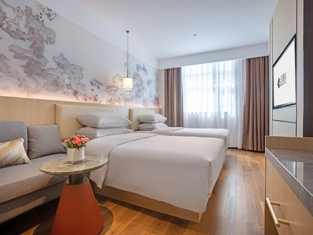 Imagen de la habitación del Hotel beijingyonghegongsiheyuanyunjujiudian. Foto 8