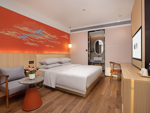 Imagen de la habitación del Hotel beijingyonghegongsiheyuanyunjujiudian. Foto 9