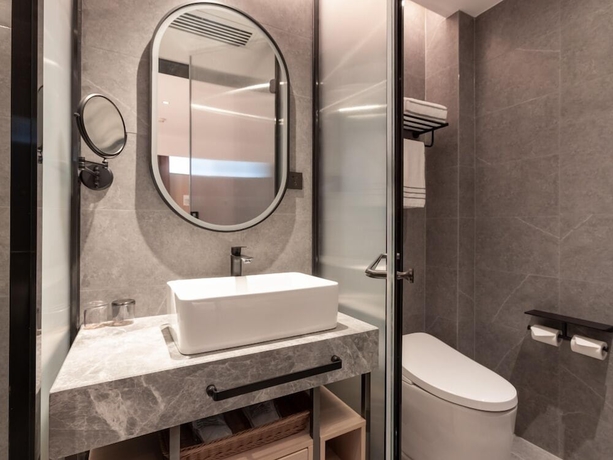 Imagen de la habitación del Hotel beijingyonghegongsiheyuanyunjujiudian. Foto 10