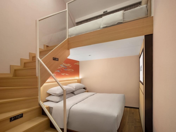 Imagen de la habitación del Hotel beijingyonghegongsiheyuanyunjujiudian. Foto 11