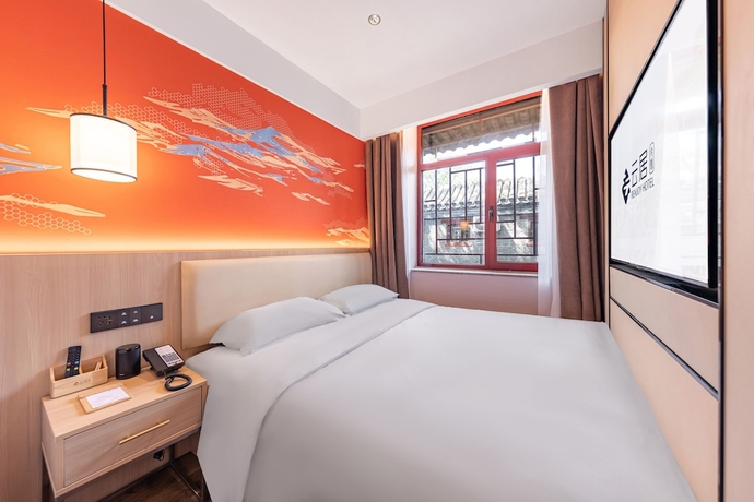 Imagen de la habitación del Hotel beijingyonghegongsiheyuanyunjujiudian. Foto 15