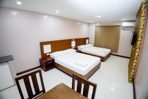 Imagen de la habitación del Hotel coastal hotel. Foto 19
