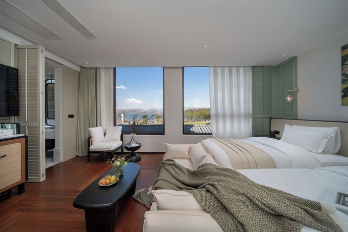 Imagen de la habitación del Hotel dalishanhaixijingminsu. Foto 14
