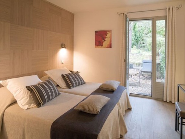 Imagen de la habitación del Hotel de Charme L\'Amandière. Foto 3