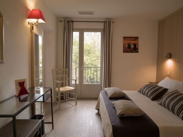 Imagen de la habitación del Hotel de Charme L\'Amandière. Foto 5