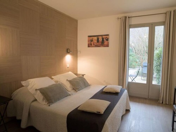 Imagen de la habitación del Hotel de Charme L\'Amandière. Foto 16