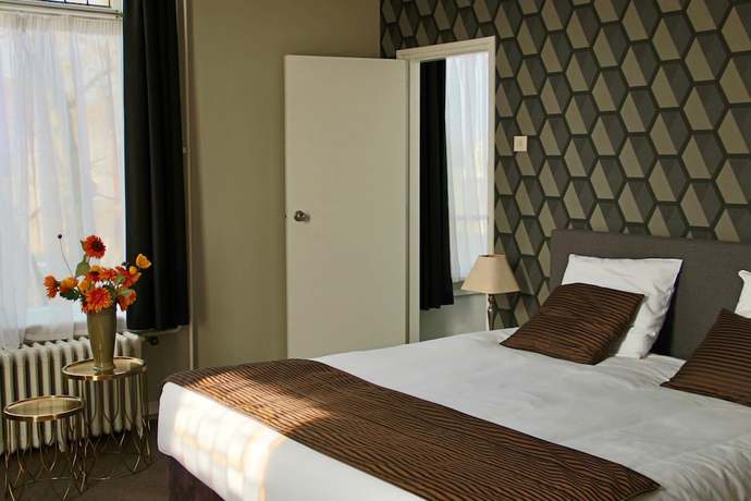 Imagen de la habitación del Hotel de Roode Leeuw. Foto 7
