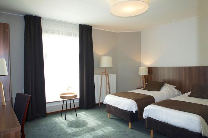 Imagen de la habitación del Hotel de Roode Leeuw. Foto 16