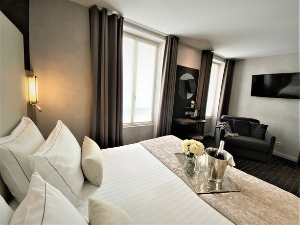 Imagen de la habitación del Hotel de la Paix, París. Foto 11