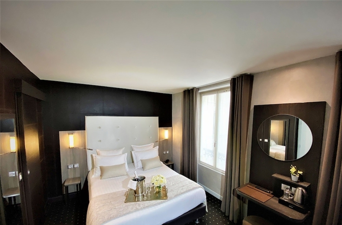 Imagen de la habitación del Hotel de la Paix, Torre Eiffel. Foto 12