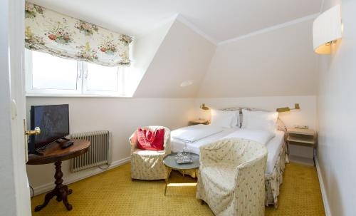 Imagen de la habitación del Hotel dermuth hotels - parkvilla w&ouml;rth. Foto 10