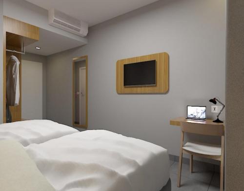 Imagen de la habitación del Hotel favehotel Kediri. Foto 18