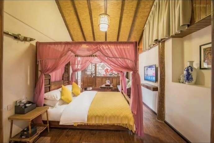 Imagen de la habitación del Hotel fenghelijiang. Foto 6