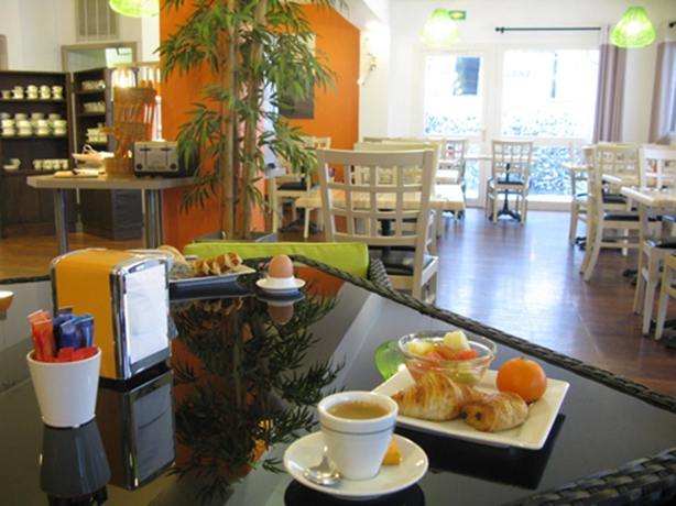 Imagen del bar/restaurante del Hotel greet Hotel Massieux Lyon Nord. Foto 3