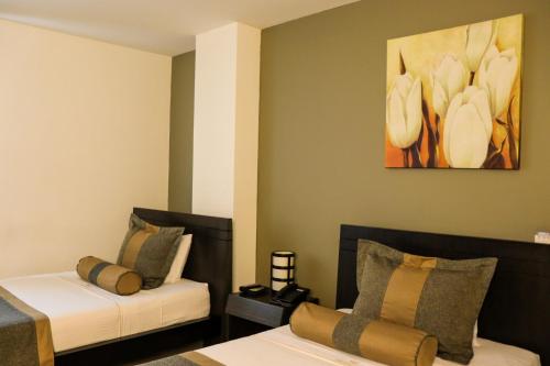 Imagen de la habitación del Hotel hotel medellin gold. Foto 17