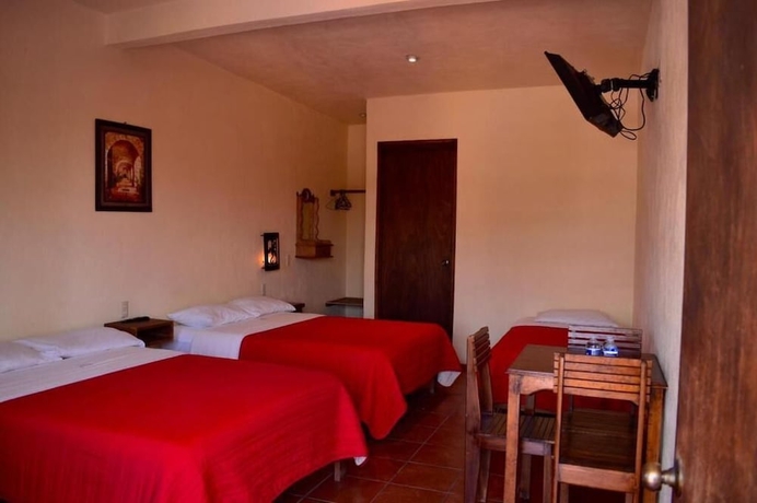 Imagen de la habitación del Hotel hotel y caba&ntilde;as quinta los cipreses. Foto 11