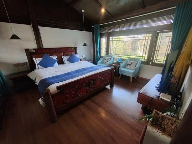Imagen de la habitación del Hotel huamushejiudian. Foto 7