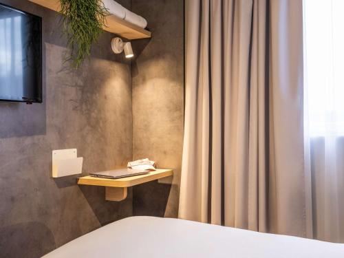 Imagen de la habitación del Hotel ibis budget Arlon Porte du Luxembourg. Foto 16