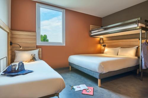 Imagen de la habitación del Hotel ibis budget Paris Porte de la Chapelle-Aréna. Foto 11