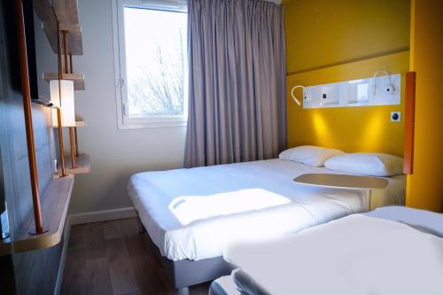 Imagen de la habitación del Hotel ibis budget Reims Parc Des Expositions, Reims. Foto 18