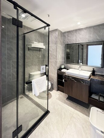 Imagen de la habitación del Hotel jiu shu feng wu mei shu guan jiu dian. Foto 11