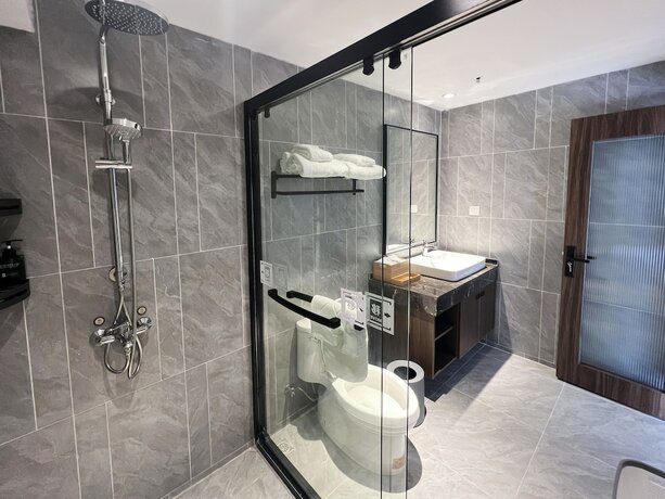 Imagen de la habitación del Hotel jiu shu feng wu mei shu guan jiu dian. Foto 13