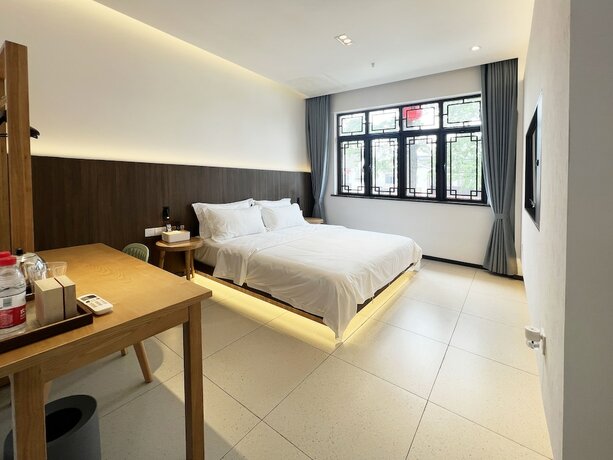 Imagen de la habitación del Hotel jiu shu feng wu mei shu guan jiu dian. Foto 14