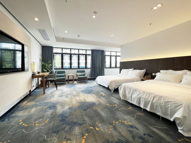 Imagen de la habitación del Hotel jiu shu feng wu mei shu guan jiu dian. Foto 15