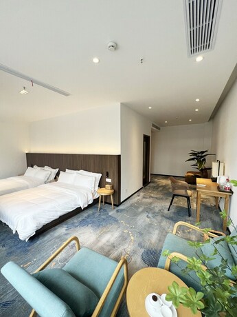 Imagen de la habitación del Hotel jiu shu feng wu mei shu guan jiu dian. Foto 16