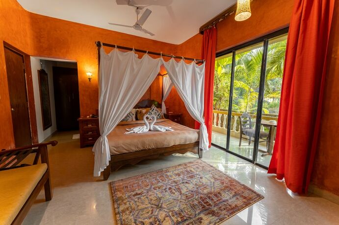 Imagen de la habitación del Hotel juSTa Morjim Beach Resort and Spa. Foto 16