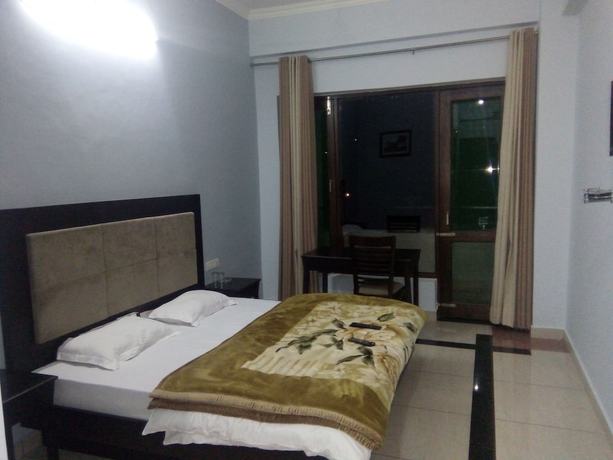 Imagen de la habitación del Hotel juSTa Palampur Resort and Convention Centre. Foto 7