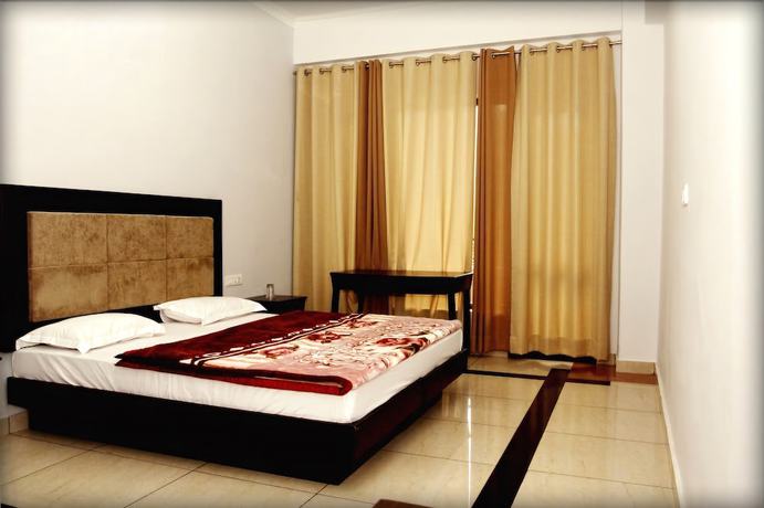 Imagen de la habitación del Hotel juSTa Palampur Resort and Convention Centre. Foto 9