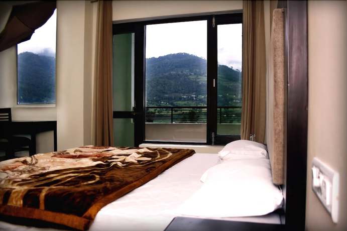 Imagen de la habitación del Hotel juSTa Palampur Resort and Convention Centre. Foto 12