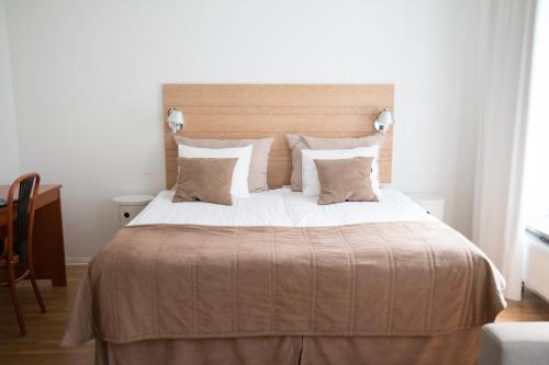Imagen de la habitación del Hotel l Aston. Foto 4
