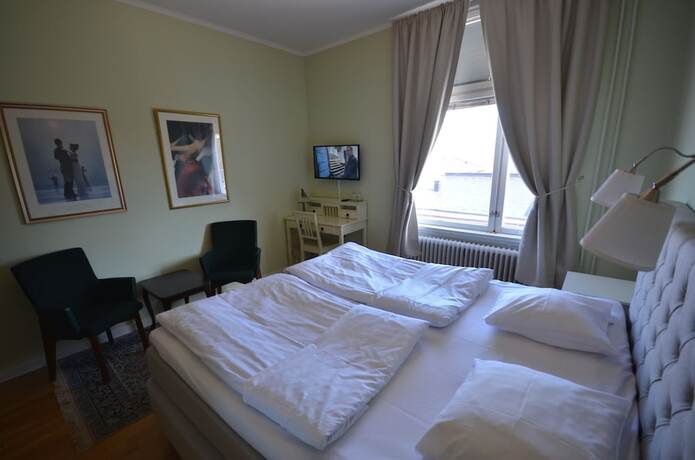 Imagen de la habitación del Hotel l Royal. Foto 13